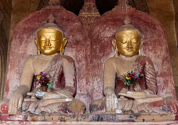 istock Two buddhas sitting in Bagan Pagoda, Burma 136719631