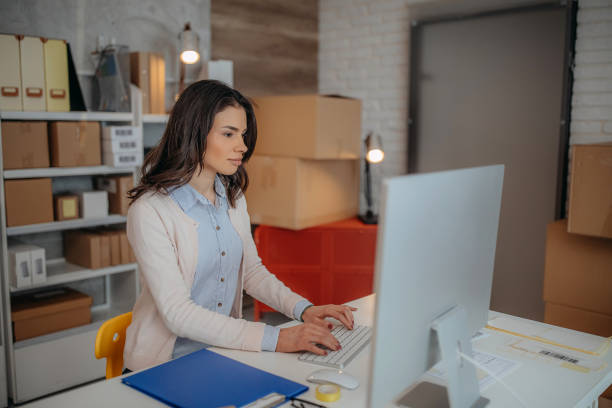 istock Woman is working at warehouse for online store. 1367196521