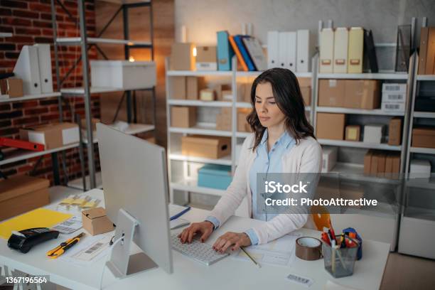 Woman Is Working At Warehouse For Online Store Stock Photo - Download Image Now - Owner, Business, Computer