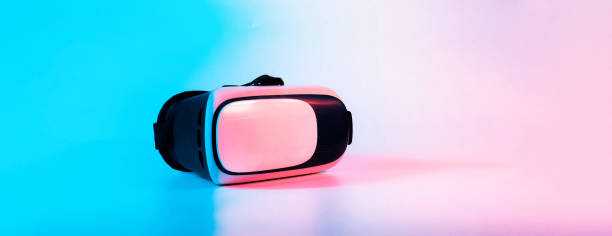istock Virtual reality headset VR. 3d digital glasses on futuristic neon tech background. VR future gadgets technology, education online, studying, video game concept. 1367196711