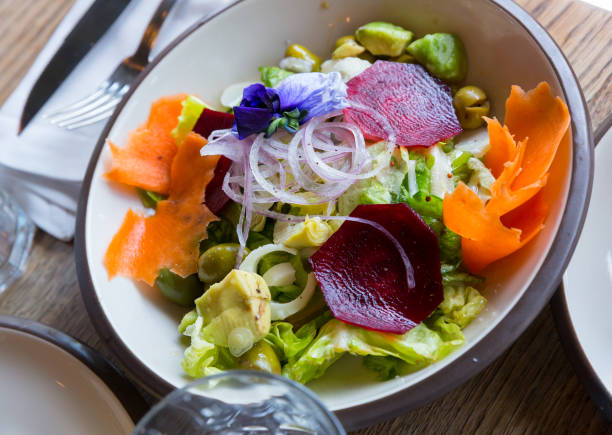 istock Appetizing salad with endive, palms hearts, avocado and radish 1367196933