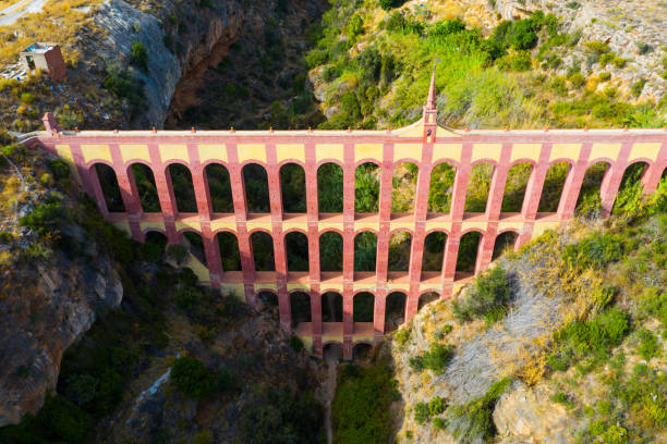 eagle aqueduct (puente del aguila) in spanish city of nerja - nerja imagens e fotografias de stock