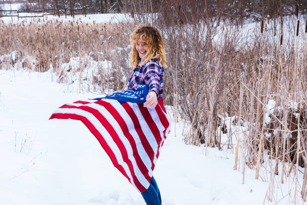 istock Lady with an American Flag 1367198471