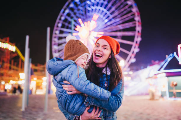 istock Mom and son at the amusement park 1367198587