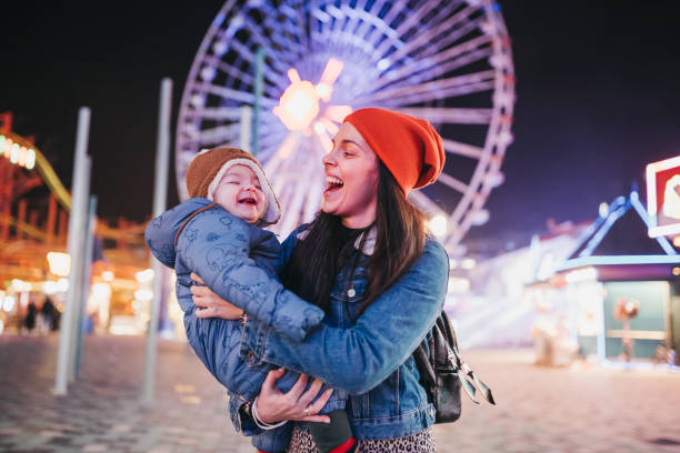 istock Hug with mommy at the amusement park 1367198671