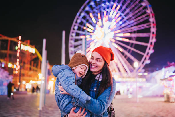 istock Happy Boy and Mother on Carousel 1367199699