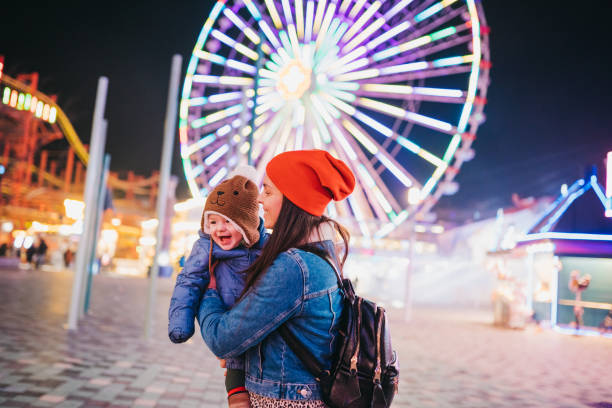 istock Hug with mommy at the amusement park 1367199705