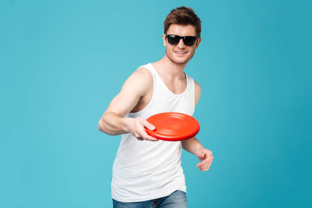 istock Handsome man holding beach summer toy. 1367205891