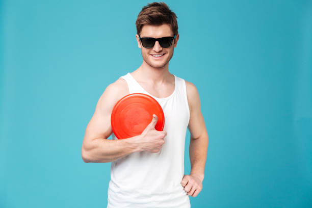 istock Handsome man holding beach summer toy. 1367205935