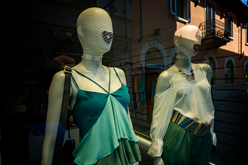 two mannequins in a shop window