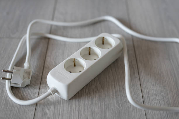 istock white extension cord on the wooden floor 1367206112
