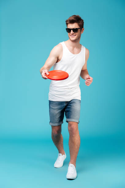 istock Man holding beach summer toy. Looking aside. 1367206853