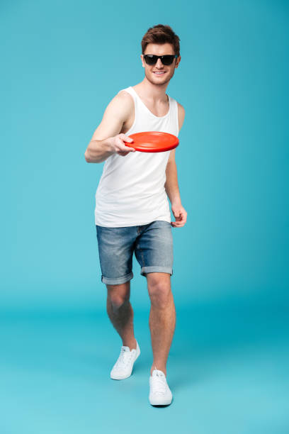 istock Handsome man holding beach summer toy. 1367207220