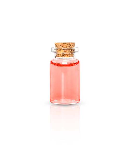 Bottle of essential red oil isolated on white background.