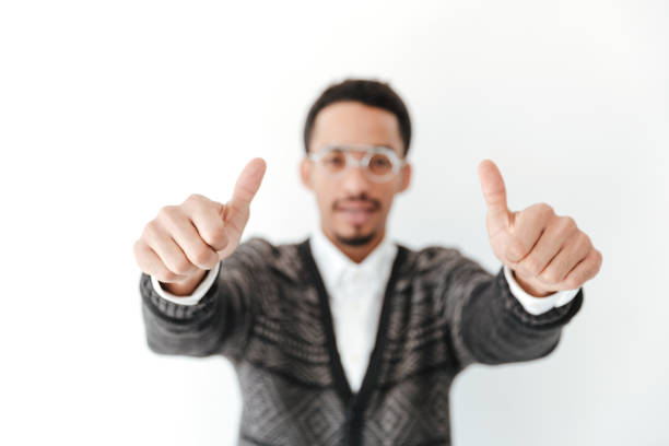 istock African man showing thumbs up. Focus on hands. 1367209573