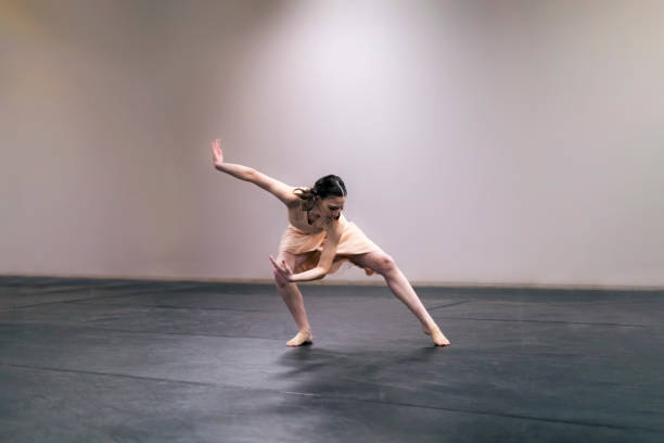 istock Young girl performing contemporary dance on stage 1367209959