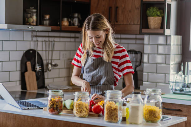 istock Young woman in the kitchen 1367210812
