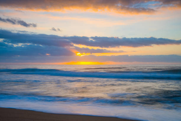 Sunrise seascape with clouds at Killcare Beach on the Central Coast, NSW, Australia.