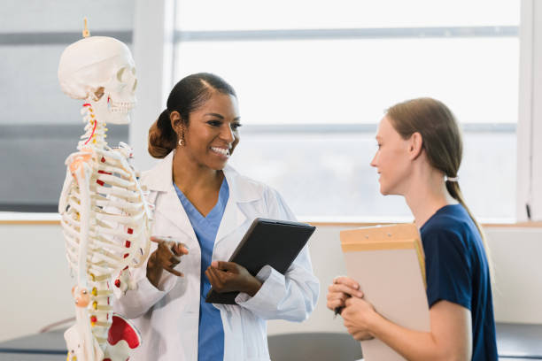 istock Female professor works one-on-one with female intern 1367213997