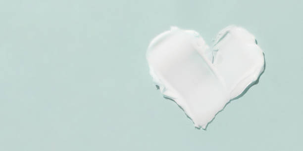 istock A smear of cosmetic cream on a blue background 1367215598