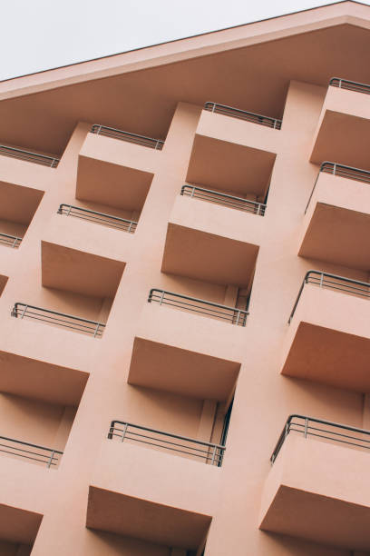 istock Vertical image of modern geometric facade details. Building in functionalism architecture style as urban background 1367215623