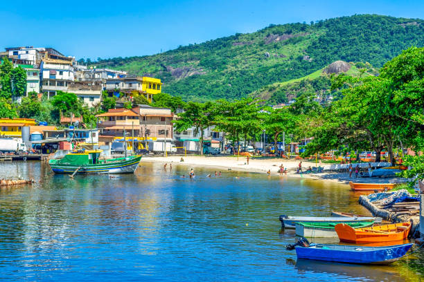 Niteroi, Rio de Janeiro, Brazil - January 17, 2022: Fishing boats by the coasts of the Guanabara Bay. Artisanal fishing is a tradition and livelihood in the Jurujuba community which is seen in the image.