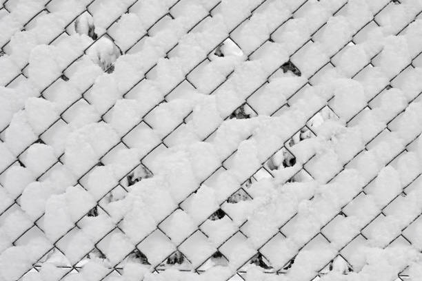 istock snow covered fence winter background 1367215883