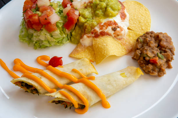 dish of typical mexican food, on a black towel - guacamole food bar vegan food imagens e fotografias de stock