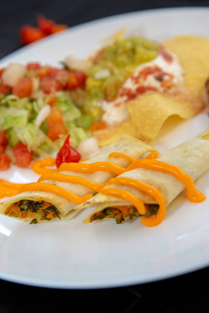 dish of typical mexican food, on a black towel - guacamole food bar vegan food imagens e fotografias de stock