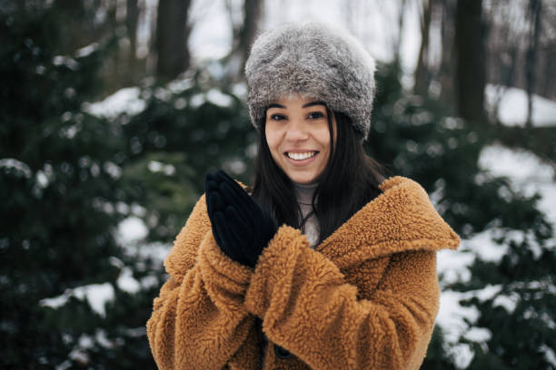 Girl looking at camera, with smile, in park.