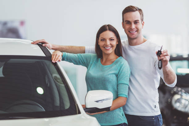 istock Couple in motor show 1367218502