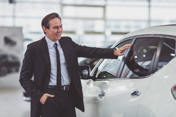 istock Businessman in motor show 1367219644