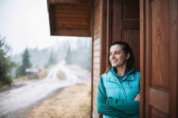 istock Smiling woman in a mountain hut. 1367219742