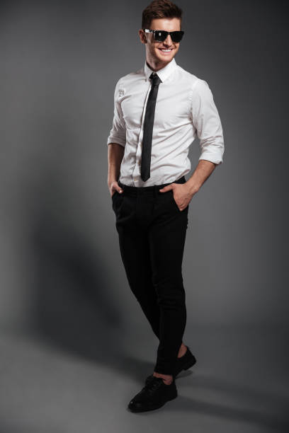 istock Cheerful young man dressed in formalwear 1367220324