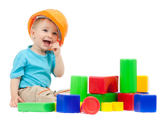 istock little boy with hard hat playing building blocks 136722100