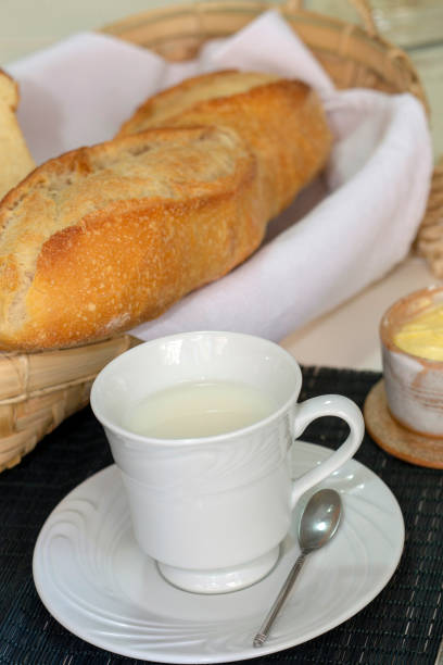 istock Breakfast table with bread, butter and cup of milk 1367221251