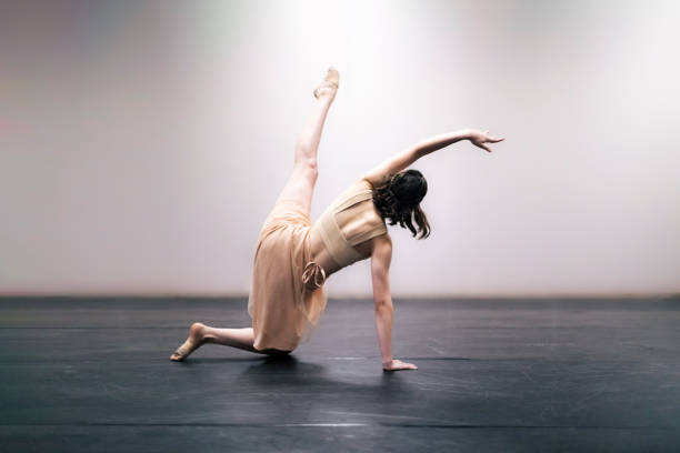 istock Young girl performing contemporary dance on stage 1367223040