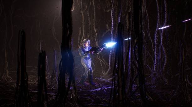 istock An astronaut with a blaster sneaks through an eerie alien dungeon on an alien planet inhabited by unusual creatures. The image is perfect for space, or sci-fi backgrounds. 3D Rendering 1367223925