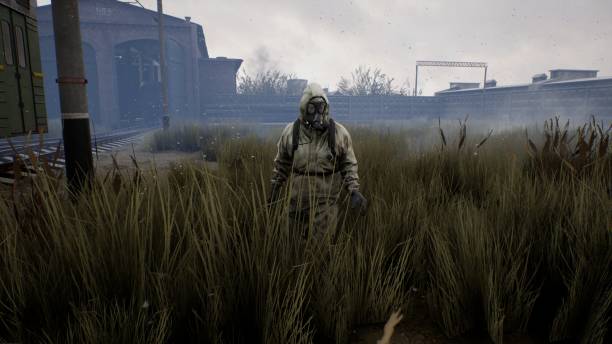 istock Post apocalyptic atmosphere with a lone survivor man and a train going nowhere. A man surviving a nuclear apocalypse. The image is ideal for sci-fi, military and apocalyptic backgrounds. 3D Rendering 1367224043