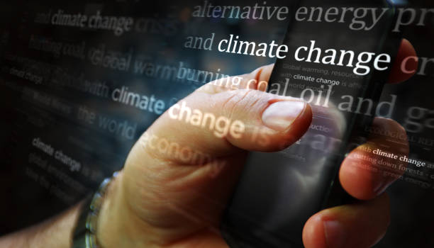 istock News titles on screen in hand with Climate Change 3d illustration 1367224092