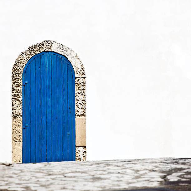 istock Blue Wooden Door White Wall 136722579