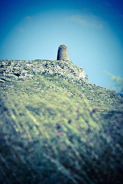 Fields and Sky: Ancient Lookout Tower in Salento, Apulia (Puglia), Italy. Grain added for the sky, desaturated.