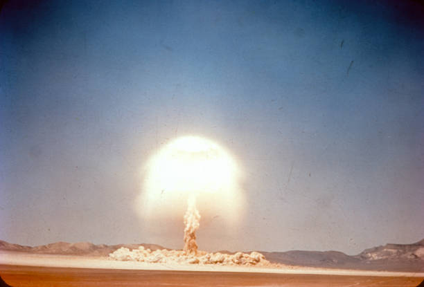 Old slide scan of atom bomb exploding in the desert stock photo