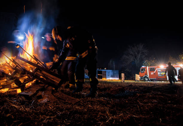 istock Fire brigade in action at night time 1367227566