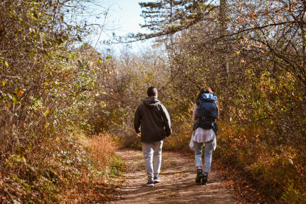 istock Young backpackers going hiking and walking through a sandstone valley 1367227580