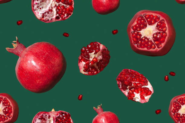istock Seamless pattern of pomegranate on a green background. 1367227664