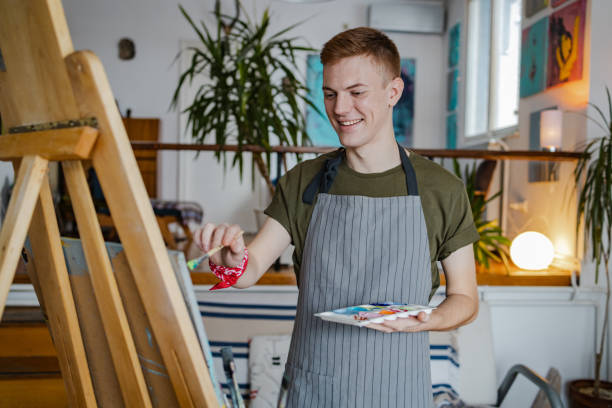istock Young painter working on his new paint in the art studio 1367230832