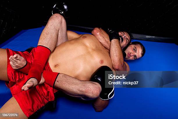 Mixed Martial Artists Ground Fighting Stock Photo - Download Image Now - Chokehold, 20-29 Years, Adult