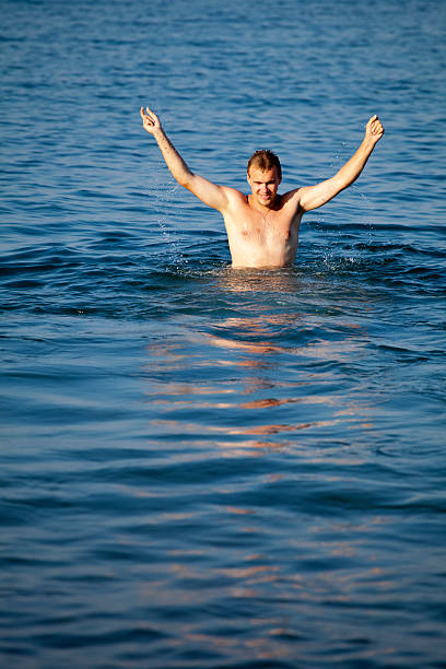 istock Young man relaxing in sea 136723285