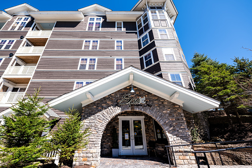 Snowshoe, USA - October 6, 2020: Exterior facade of modern building sign Spa at Snowshoe wellness center for massage and relaxation in West Virginia small ski resort town village